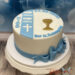 Erstkommunionstorte - Blaue Fische und weiße Fische verzieren neben dem Kreuz und Klech als religiöse Symbole die Torte.