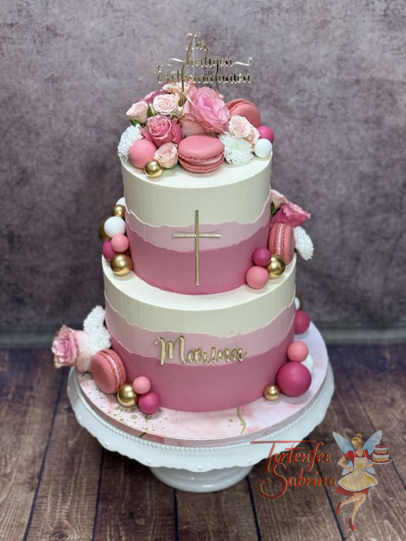 Erstkommunionstorte - Rosa Kugeln und auch Weisse verzieren die mehrfärbig eingestriche Torte mit goldenem Caketopper.