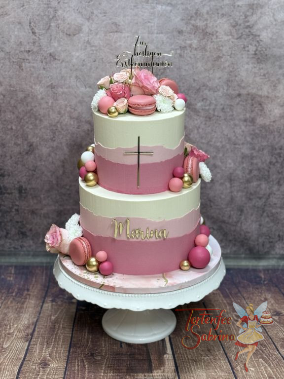 Erstkommunionstorte - Rosa Kugeln und auch Weisse verzieren die mehrfärbig eingestriche Torte mit goldenem Caketopper.