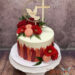 Erstkommunionstorte - Rote Blumen und rote Farbe zieren rundherum die Torte. Ganz oben ist der personalisierte Caketopper.