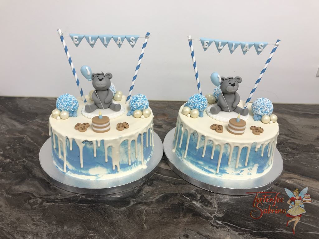 Geburtstagstorte Buben - Bär mit Ballon und Torte. Dieser Drip Cake wurde auch noch mit Cookies und Zuckerkugel sowie einer Girlande verziert.