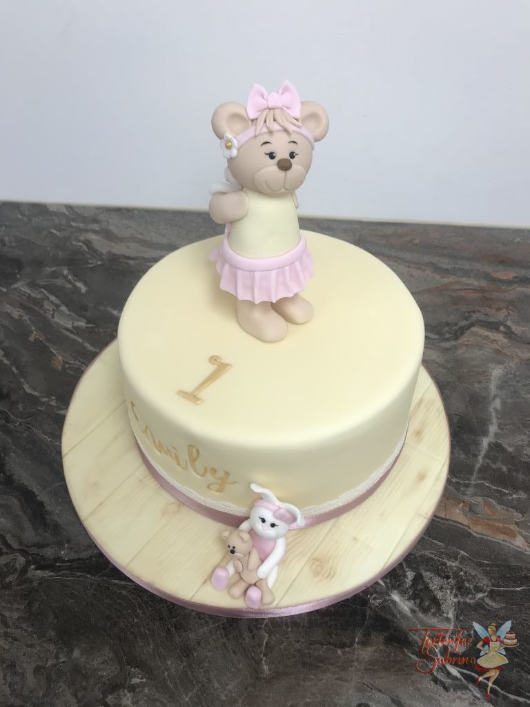 Geburtstagstorte Mädchen - Bär mit Häschen auf der Torte und neben der Torte umgekehr. Der Name ist vertieft und in goldener Farbe.