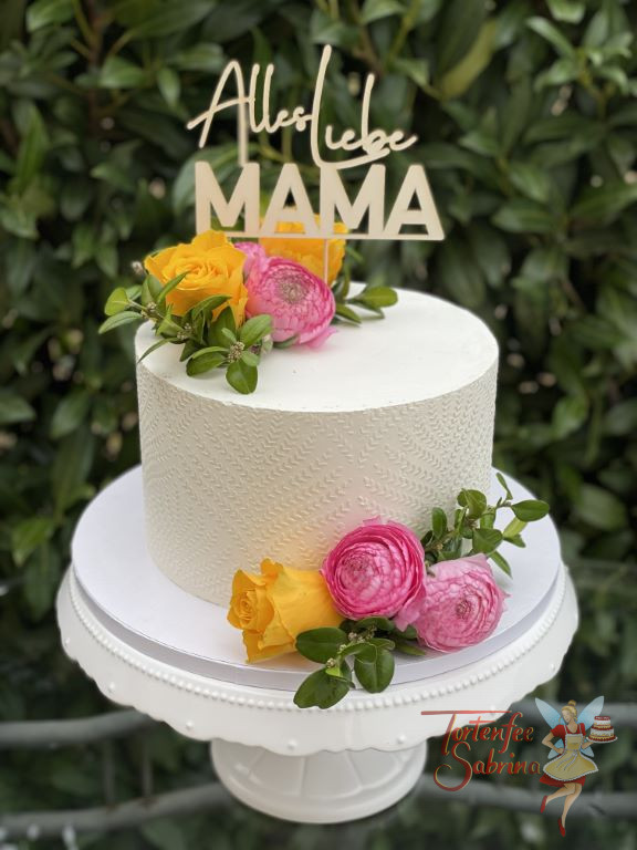 Geburtstagstorte Erwachsene - Blumen für Mama in den Farben gelb und rosa. Ebenso auf der Torte ein Muster aus Buttercreme.