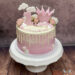 Geburtstagstorte - Das erste Krönchen für das liebe Geburtstagskind gibt es natürlich in der Farbe rosa. Rosen schmücken ebenfalls die Torte.