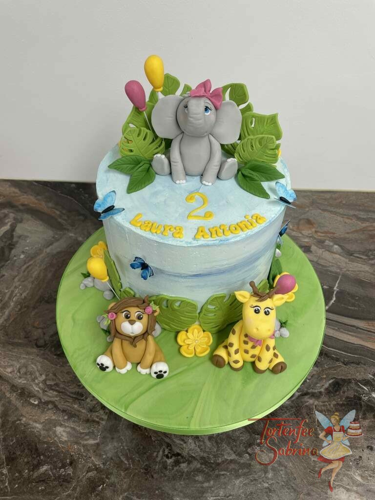Geburtstagstorte Mädchen - Der Elefant und seine Freunde mitten im Dschungel und sitzen ziwschen Blättern und Luftballons.