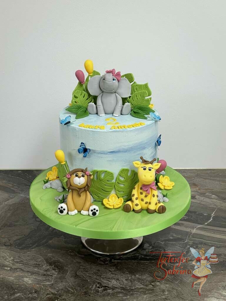 Geburtstagstorte Mädchen - Der Elefant und seine Freunde mitten im Dschungel und sitzen ziwschen Blättern und Luftballons.