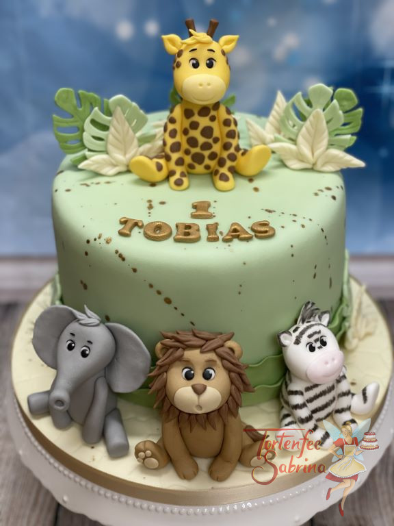 Geburtstagstorte Buben - Die Giraffe mit seinen Gästen ist fröhlich um und auf der Torte platziert und bewundert die Blätter.