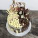 Geburtstagstorte Erwachsene - Drip in Schwarz und Weiß mit vielen verschiedenen Süßigkeiten mit Milchschokolade und weißer Schokolade
