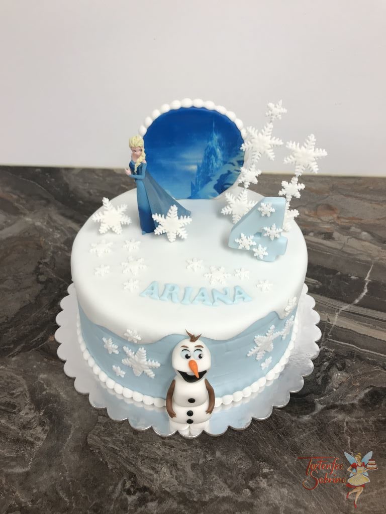 Geburtstagstorte Mädchen - Elsa´s Eispalast im Hintergrund, umgeben von vielen Schneeflocken, Elsa und Olaf.