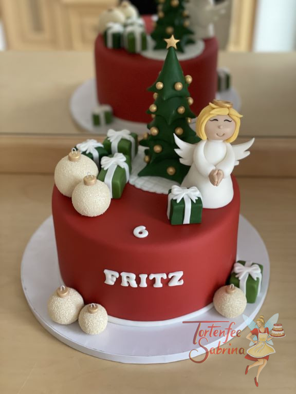 Geburtstagstorte Buben - Es weihnachtet sehr auf dieser roten Torte, den es gibt einen Weihnachtsbaum, Kugel, Geschenke und das Christkind.