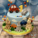 Geburtstagstorte Buben - Flotte Tiere sind auf der Torte versammelt und bewundern die vielen bunten Fahrzeuge.