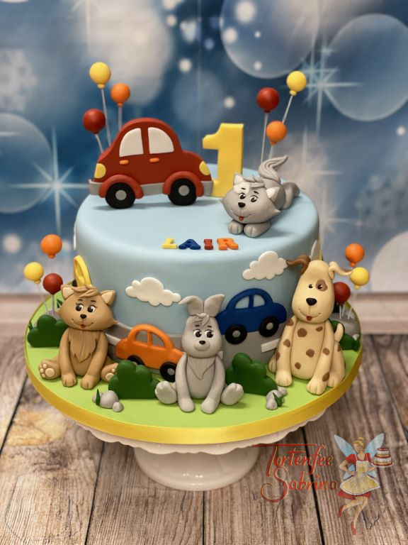 Geburtstagstorte Buben - Flotte Tiere sind auf der Torte versammelt und bewundern die vielen bunten Fahrzeuge.