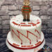 Geburtstagstorte Erwachsene - Freddy Krueger von dem Film Nightmare on Elm Street ist ganz oben auf der Torte umgeben von roten Spritzern.