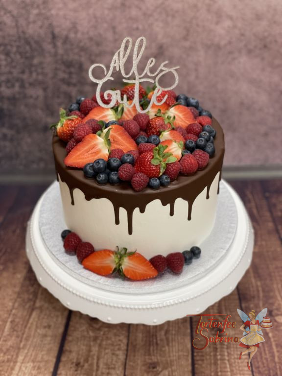 Geburtstagstorte Erwachsene - Früchte und glitzernder Cake Topper zieren diesen Drip Cake welcher mit Schokolade überzogen ist.
