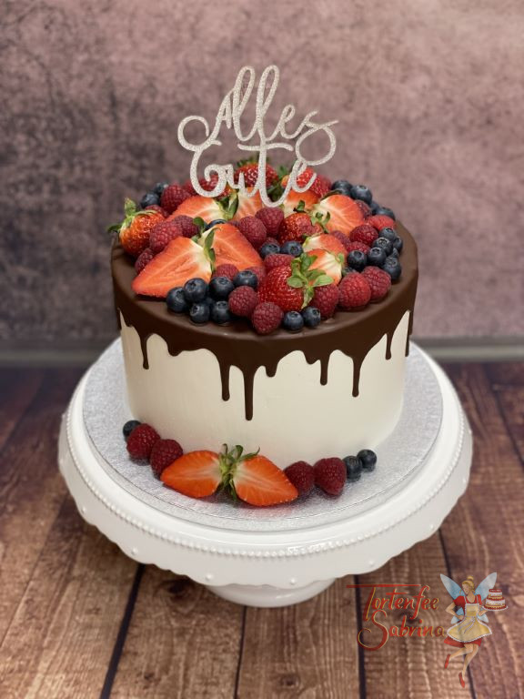 Geburtstagstorte Erwachsene - Früchte und glitzernder Cake Topper zieren diesen Drip Cake welcher mit Schokolade überzogen ist.