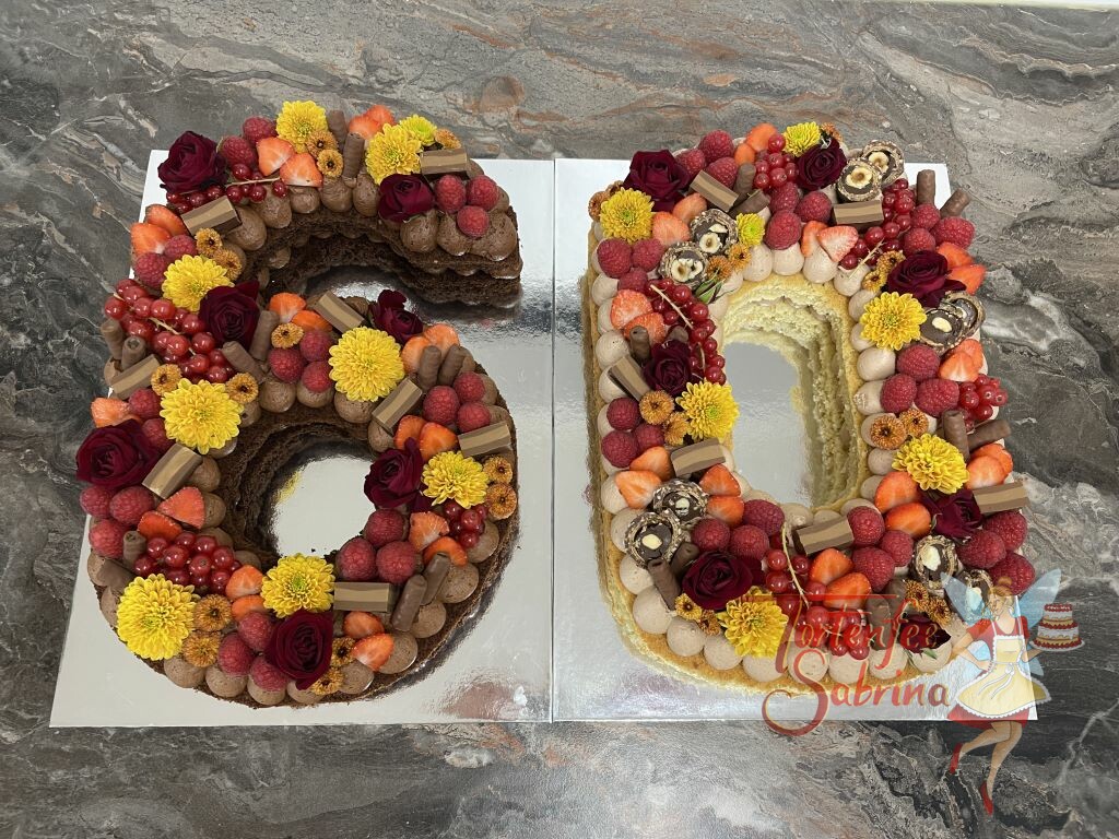 Geburtstagstorte Erwachsene - Gelbe und rote 60zig, hier wurde die Numbercake mit gelben und roten Blumen sowie Süßigkeiten verziert.