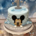 Geburtstagstorte Buben - Glücklicher Mickey lächelt von der Torte, welche oben von der Zahl 1 und vielen Sternen verziert wird.
