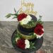 Geburtstagstorte Erwachsene - Gold und Schwarz mit Blumen und ganz oben auf der Torte ist ein Cake Topper.