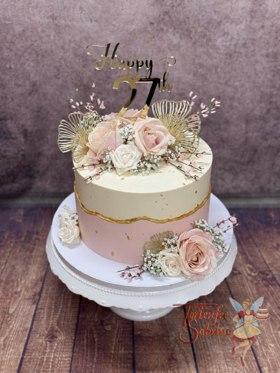 Geburtstagstorte Erwachsene - Goldene Flügel eines Schmetterlings verzieren die Torte welche durch eine goldene Line geteilt wurde.