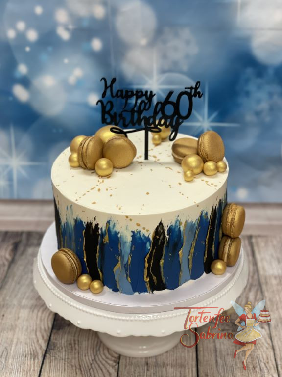Geburtstagstorte - Goldene Macarons bilden den Blickfang neben den wunderschönen Farbstreifen in verschiedenen Blautönen.