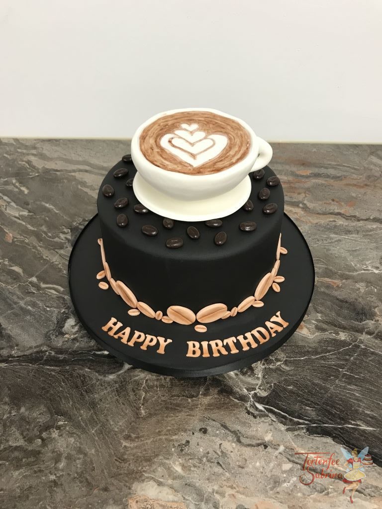 Geburtstagstorte Erwachsene - Häfferlkaffee mit Herz, auf der schwarzen Torte mit Kaffeebohnen steht ein Häferl mit einem Herz aus Schaum.