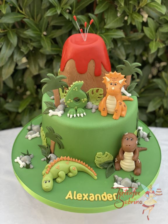 Geburtstagstorte Buben - Heiß um den Vulkan, aber die Dinosaurier stört das nicht, da es noch jede Menge grün auf der Torte gibt.