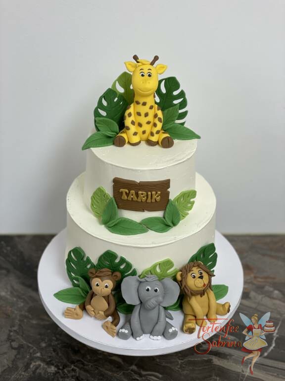 Geburtstagstorte Buben - Im Dschungel ist was los, mit von der Partie sind ein Affe, ein Löwe, ein Elefant und eine Giraffe.