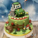 Geburtstagstorte Buben - Kleiner grüner Traktor ist bei seinen Freunden der Katze und dem Hund auf dem Bauernhof.