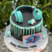 Geburtstagstorte Mädchen - Kopfhörer mit Tik Tok Symbol auf der Seite, den oberen Abschluß der Torte bildet ein 2 färbiger Drip.