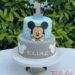 Geburtstagstorte Buben - Mickey mit blauen und grauen Sterne und einer ganz großen 1 oben. Die Torte wurde in den Farben blau und grau eingedeckt.