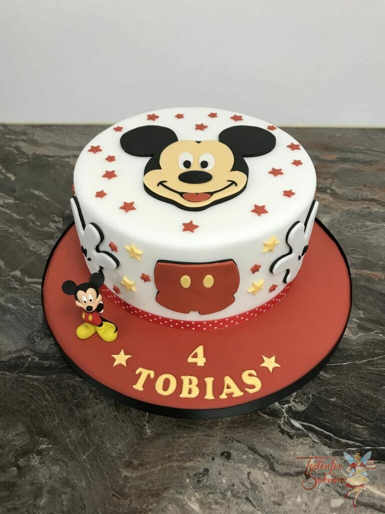 Geburtstagstorte Buben - Mickey und die rote Hose, die Torte wurde noch mit vielen bunten Sternen und den Handschuhen verziert.