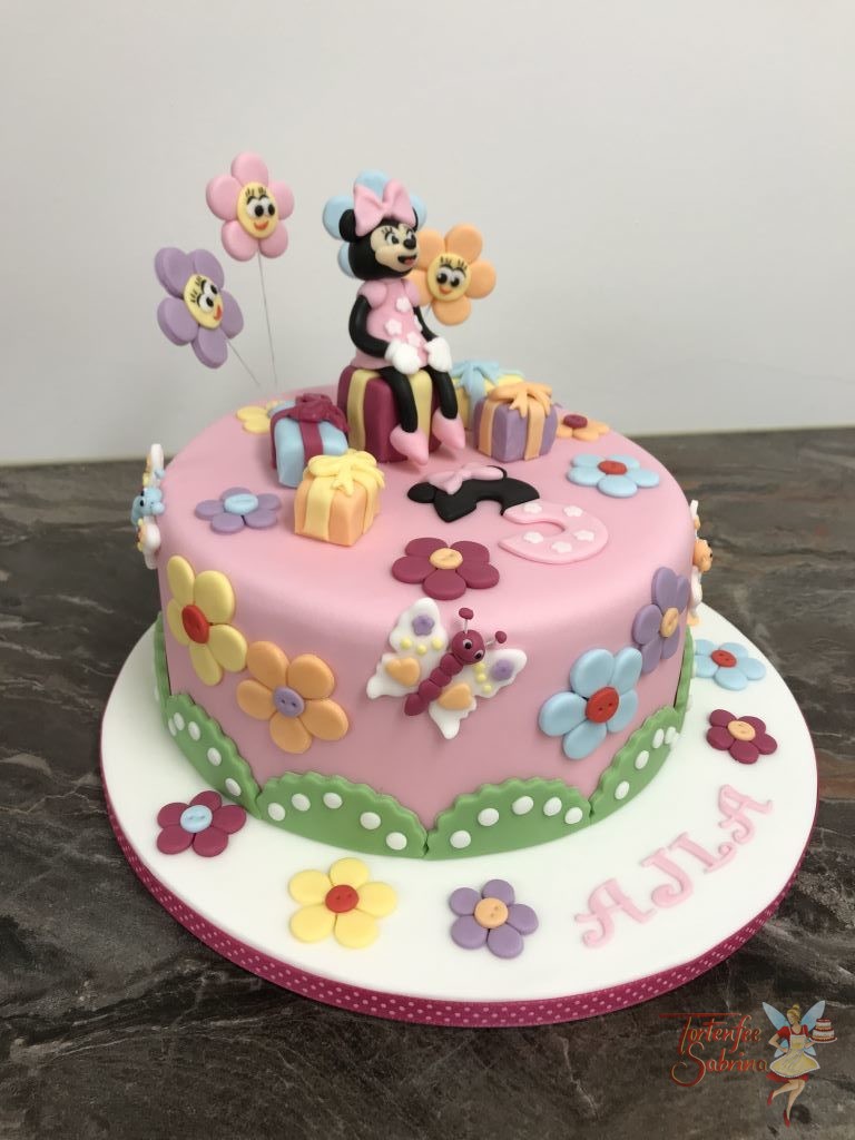 Geburtstagstorte Mädchen - Minnie Mouse mit Blumen und auf Geschenken sitzend mit rosa Kleid