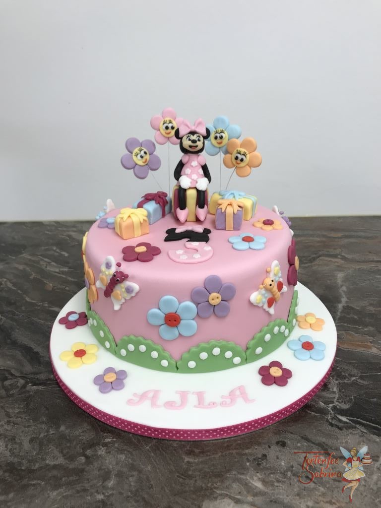 Geburtstagstorte Mädchen - Minnie Mouse mit Blumen und auf Geschenken sitzend mit rosa Kleid