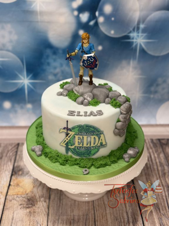 Geburtstagstorte - Mutiger Link von der Legende von Zelda, steht oben auf der Torte mit seinem Schwert und Schild.