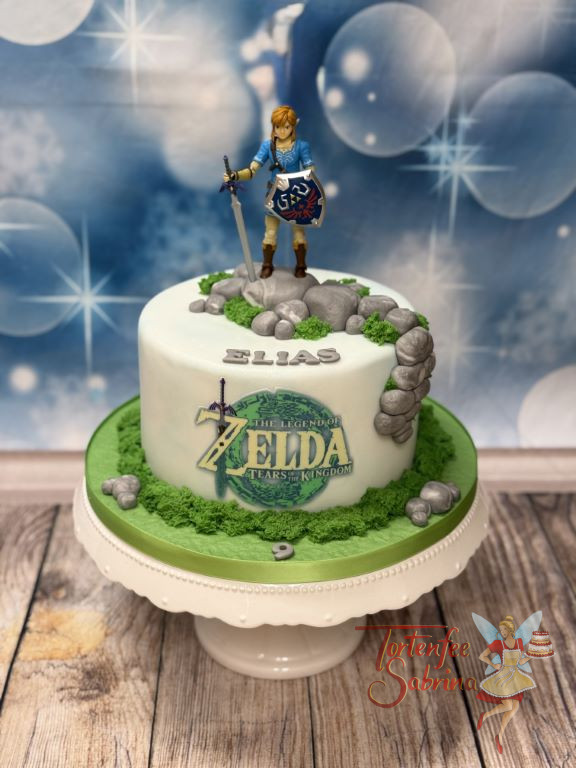 Geburtstagstorte - Mutiger Link von der Legende von Zelda, steht oben auf der Torte mit seinem Schwert und Schild.