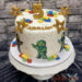 Geburtstagstorte Buben - Ninjago Team von Lego macht die Torte unsicher und zeigen sich alle.Oben zieren Wurfsterne und Legosteine die Torte.
