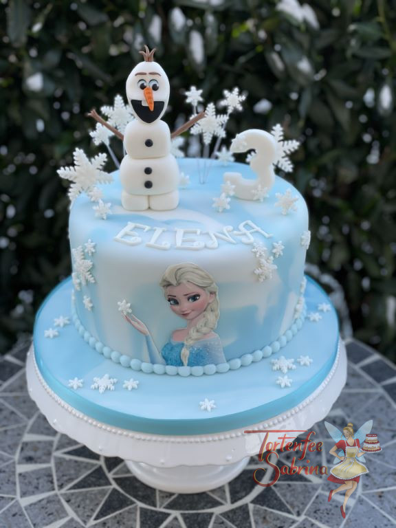 Geburtstagstorte Mädchen - Olafs Schneeflocken rieseln über die Torte, diese im wurde im Marble-Design eingedeckt.