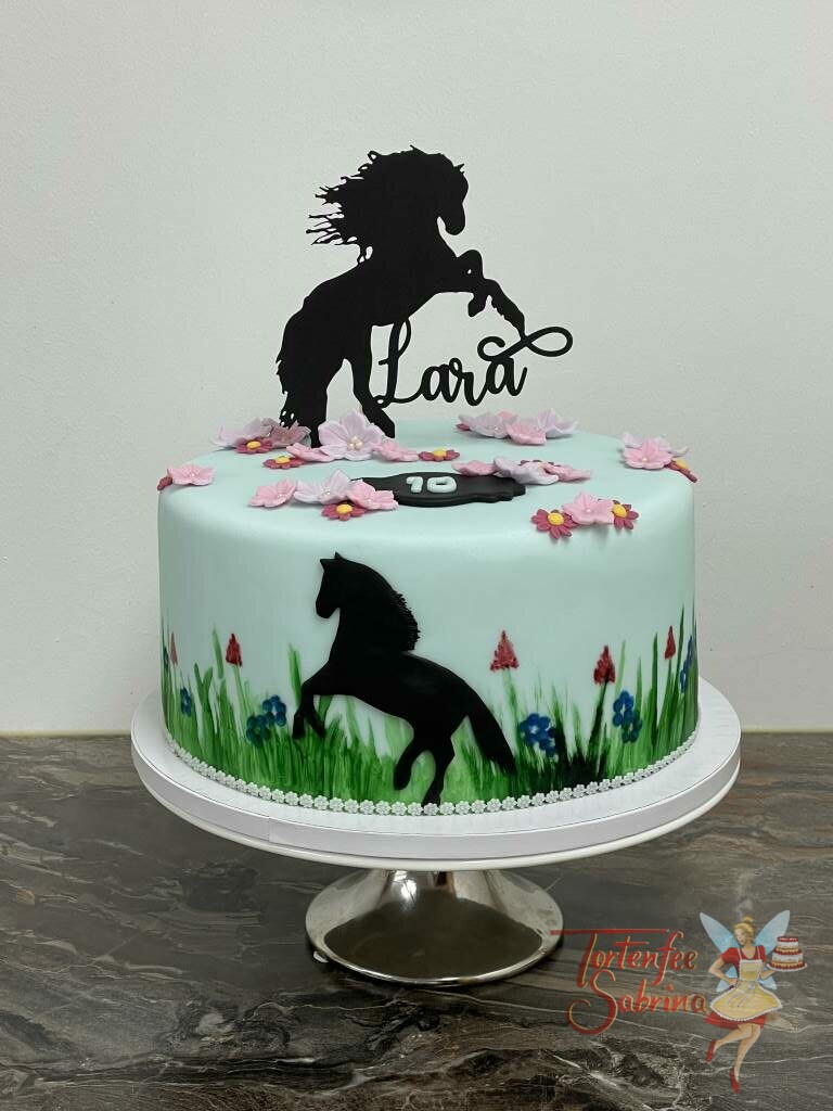 Geburtstagstorte Mädchen - Pferd auf der Blumenwiese zwischen vielen bunten Blumen, ganz oben auf der Torte der Cake Topper als Pferd.