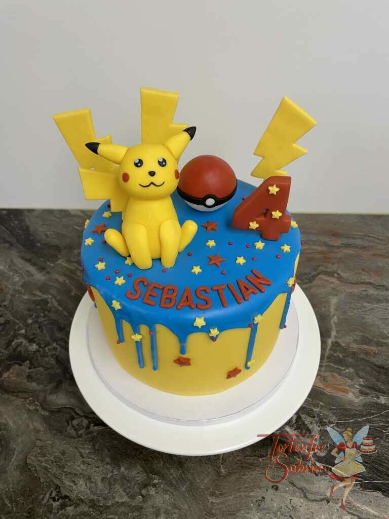 Geburtstagstorte Buben - Pokémon mit blauem Drip und Sternen in den Fraben rot und gelb. Mit auf der Torte Pikatchu und der Pokeball.