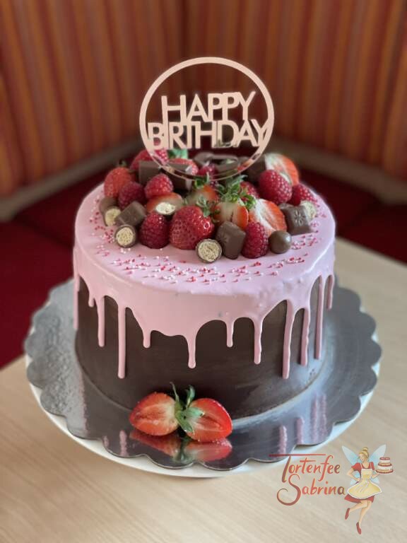 Geburtstagstorte Erwachsene - Rosa Drip mit Erdbeeren und Himbeeren, gekrönt wird die Torte von einem Cake Topper.