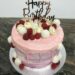 Geburtstagstorte Erwachsene - Rosa Drip mit Süßem, die Torte wurde außen rosa-marmoriert eingestrichen und mit Früchten und Süßem verziert.