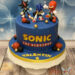 Geburtstagstorte Buben - Sonic düst dem Bösewicht Shadow mit seiner Freundin Knuckles davon. Vorne ziert das Logo die Torte.