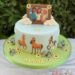 Geburtstagstorte Mädchen - Spirit und seine Freunde, die Pferde stehen unten auf der Wiesen und die Freunde sind oben auf der Torte.