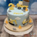 Geburtstagstorte Buben - Starke Baufahrzeuge helfen alle zusammen um die Torte zu verzieren, Mischwagen, Bagger und LKW sind mit dabei.