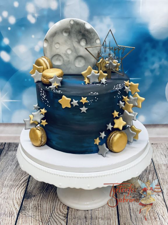 Geburtstagstorte Erwachsene - Sterne in der Nacht zieren die in dunklen Blautönen eingestrichenen Torte. Die Sterne sind gold.