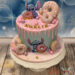 Geburtstagstorte Mädchen - Stitch schmeck's und er macht sich über all die köstlichen Donuts mit Zuckerstreusel her.