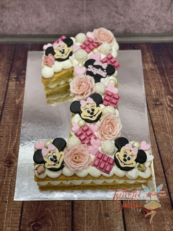 Geburtstagstorte Mädchen - Süße Minnie Mouse ist auf dem Numbercake zusehen. Die Eins wurde mit Blumen und Süßigkeiten verziert.