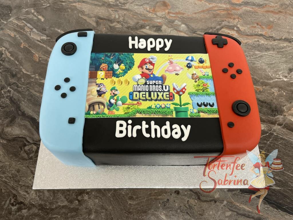 Geburtstagstorte Buben - Super Mario Bros.U Deluxe läuft gerade auf dem Bildschirm der Nintendo Switch mit den Farben rot und blau.