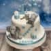 Geburtstagstorte Buben - Teddys Geschenke sind oben auf der Torte plaziert, mit dem Elefant wird noch die Wimpelkette gerichtet.