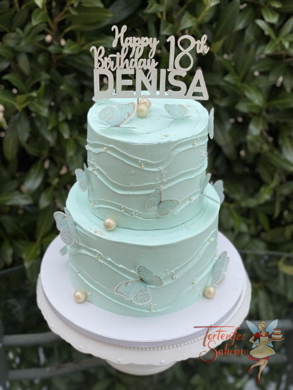 Geburtstagstorte Erwachsene - Türkise Schmetterlinge flattern und lassen sich auf der Torte nieder, ganz oben ziert die Torte ein Cake Topper.